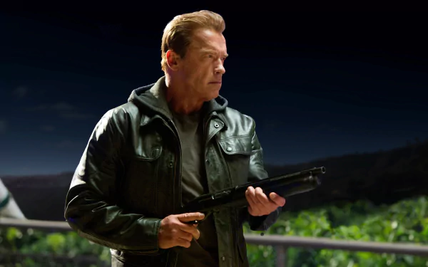 HD wallpaper featuring Arnold Schwarzenegger from Terminator Genisys, poised with a gun against a night backdrop.