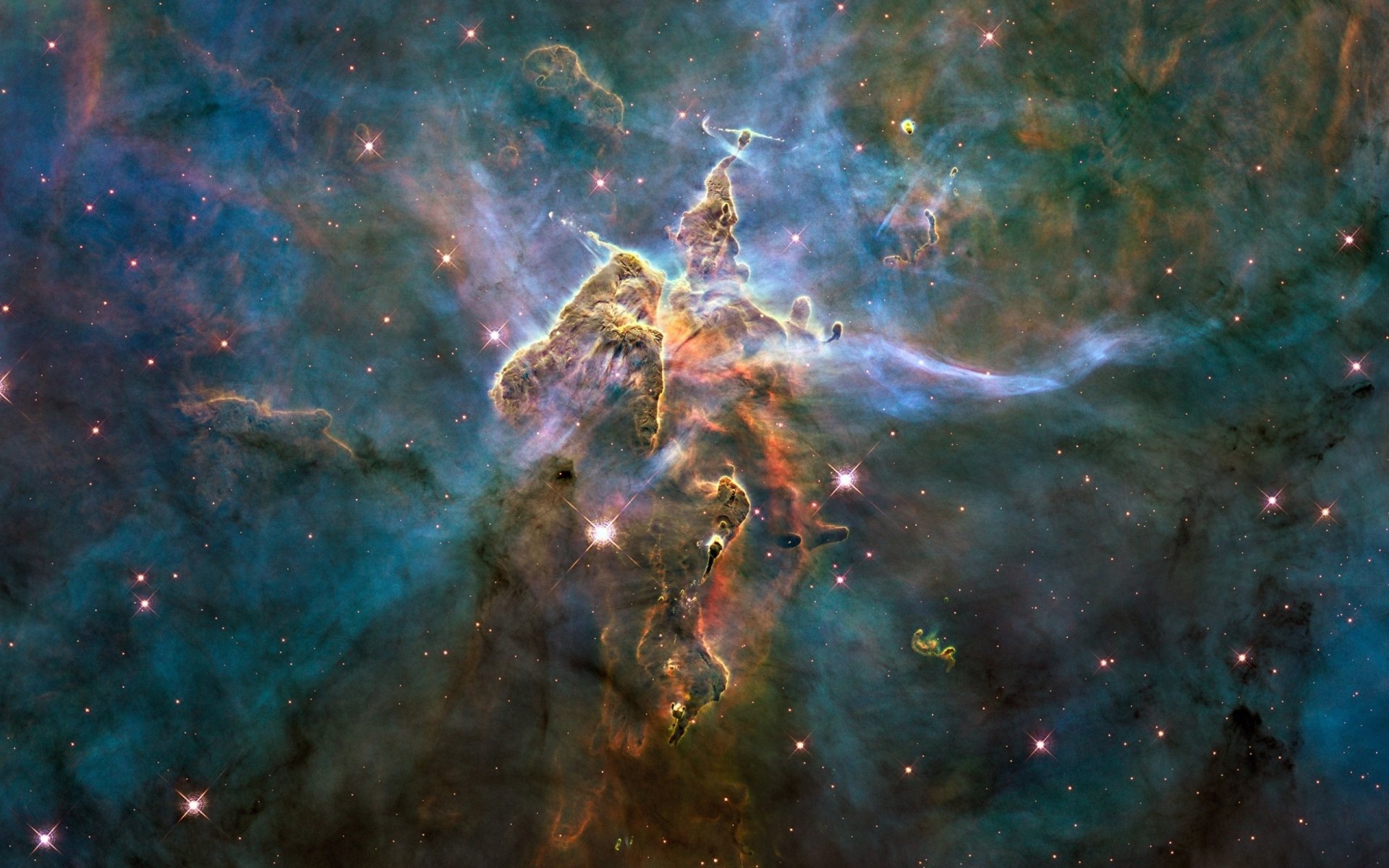 Vivid HD desktop wallpaper of the Carina Nebula captured by Hubble, showcasing vibrant cosmic clouds and stars with a sci-fi inspired nebular glow.