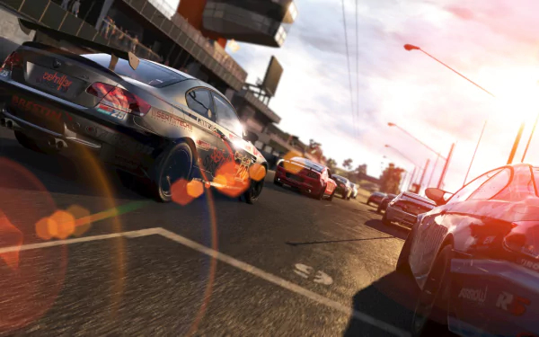 A dynamic scene from the video game Project Cars, featuring sleek race cars speeding down a sunlit track, captured in a stunning HD PC desktop wallpaper.