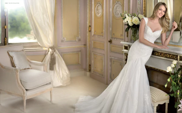 A woman in an elegant dress poses in a beautifully decorated room adorned with flowers, showcasing a sophisticated and serene atmosphere.