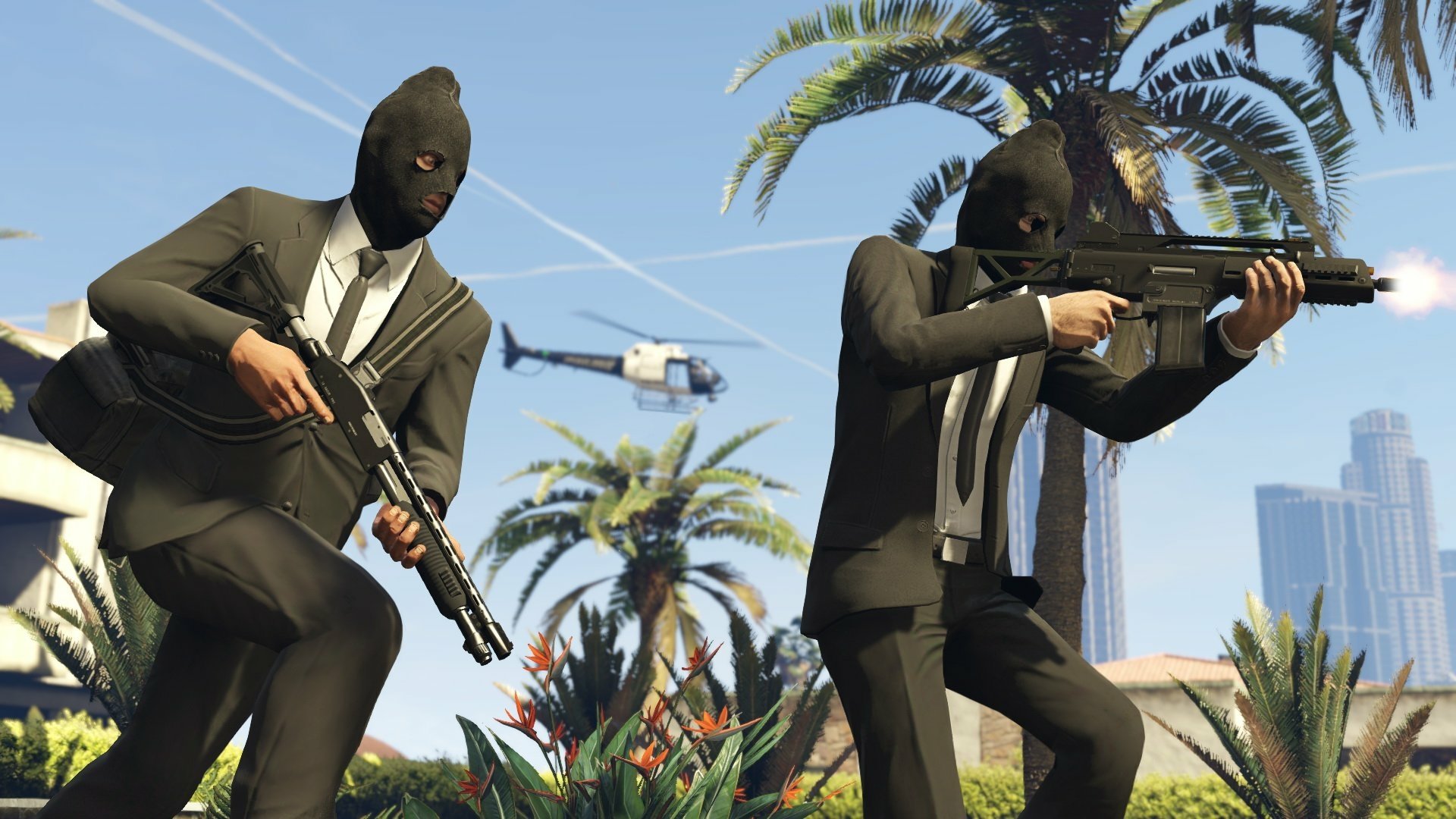 Two masked characters in suits wielding guns, set against a backdrop of palm trees and a helicopter, creating an action-packed scene from Grand Theft Auto V. HD PC wallpaper.