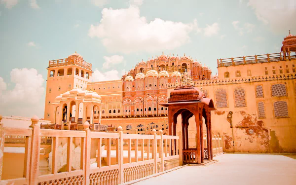 HD PC wallpaper featuring the intricate architecture of the man-made Hawa Mahal under a partly cloudy sky.