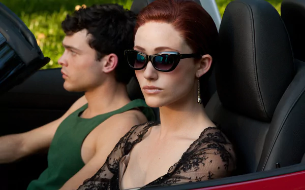 Movie still from Beautiful Creatures: a woman in sunglasses and lace top rides in a red convertible with a man driving. 5K Ultra HD PC desktop wallpaper/background.
