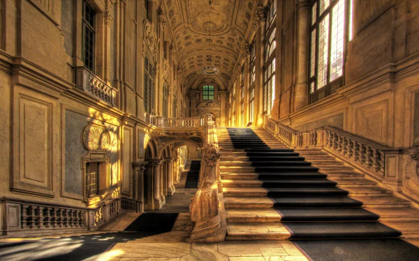 Interior view of the grand, ornately decorated staircase in Palazzo Madama, Turin, captured as an HD PC desktop wallpaper and background.