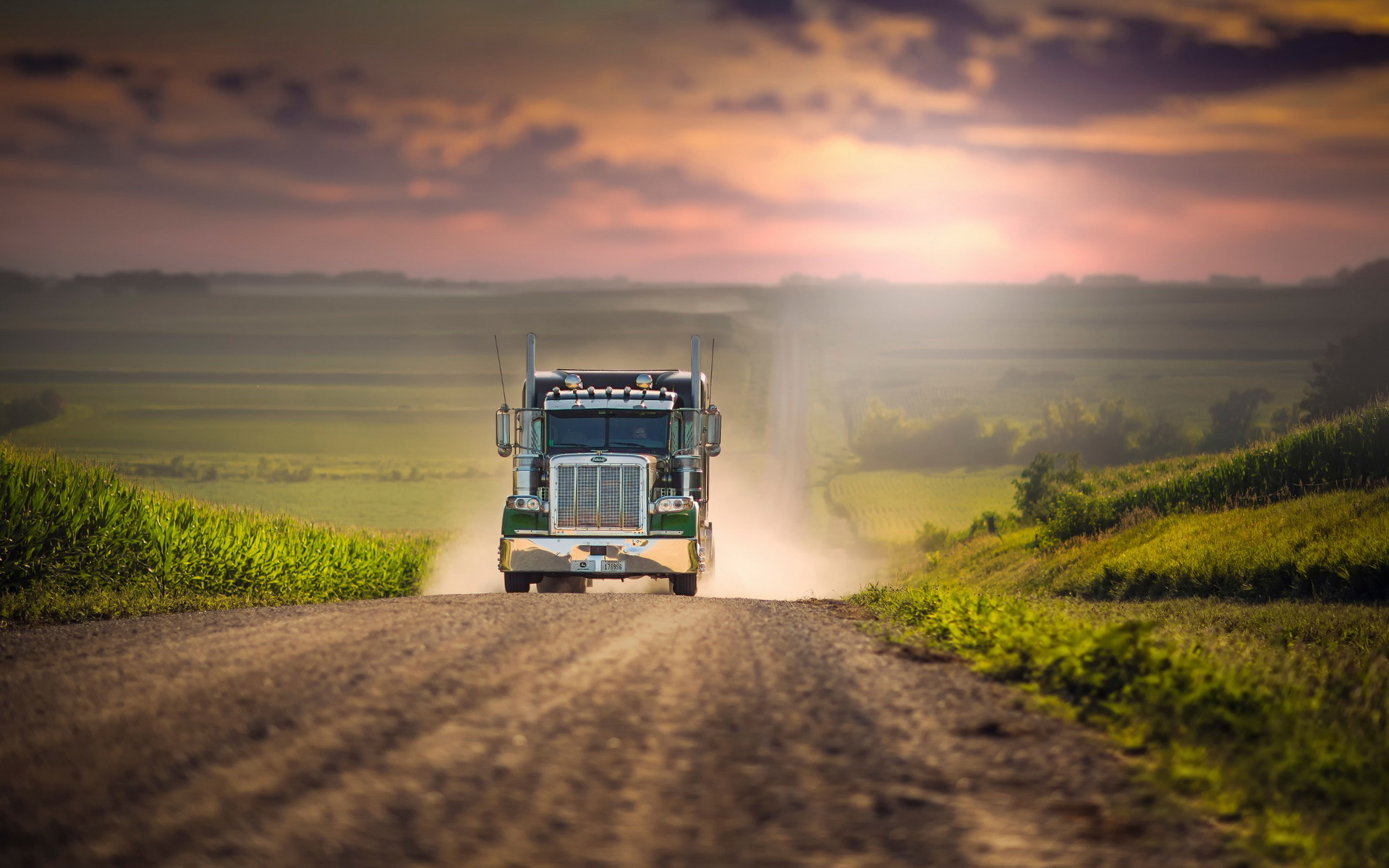 Stunning HD Wallpaper of a Truck Driving Through Scenic Landscapes