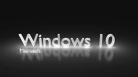 A sleek 4K Ultra HD desktop wallpaper featuring the illuminated text Windows 10 with a reflective surface, showcasing modern technology aesthetics.