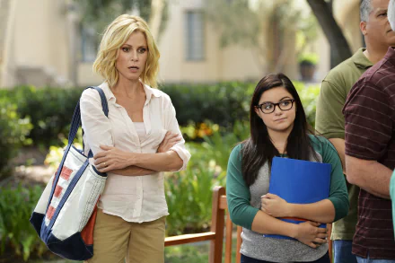 HD wallpaper from Modern Family featuring two characters standing side by side with a concerned expression.