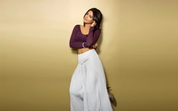 HD desktop wallpaper featuring Bollywood actress Catherine Tresa in a stylish outfit against a plain beige background.