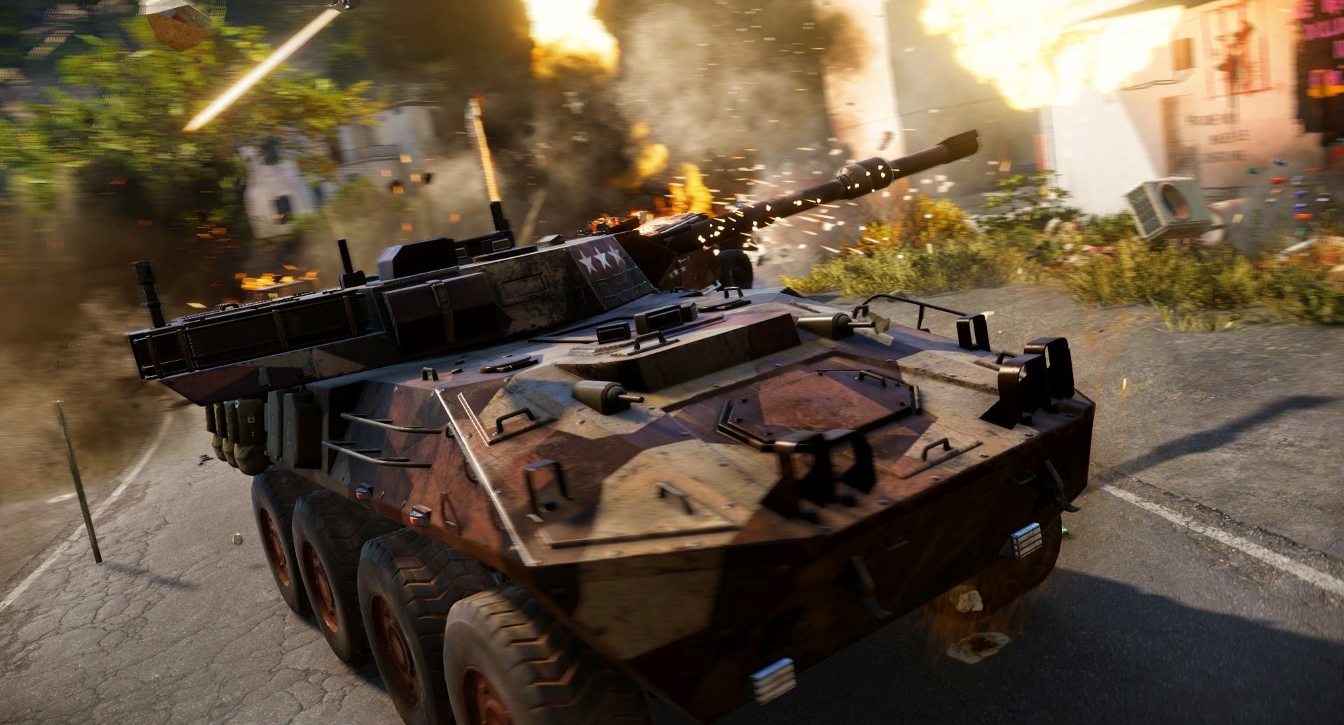 HD PC desktop wallpaper featuring intense action from the video game Just Cause 3, showcasing a heavily armored military vehicle in a fiery urban battle scene.