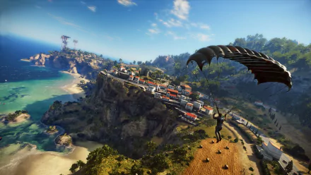 Video game hero Rico Rodriguez from Just Cause 3 parachutes toward a sunlit coastal island with a cliffside town and turquoise sea — HD PC desktop wallpaper.