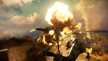HD PC desktop wallpaper from the video game Just Cause 3, depicting a dramatic helicopter explosion with fiery clouds and a smoky battlefield.