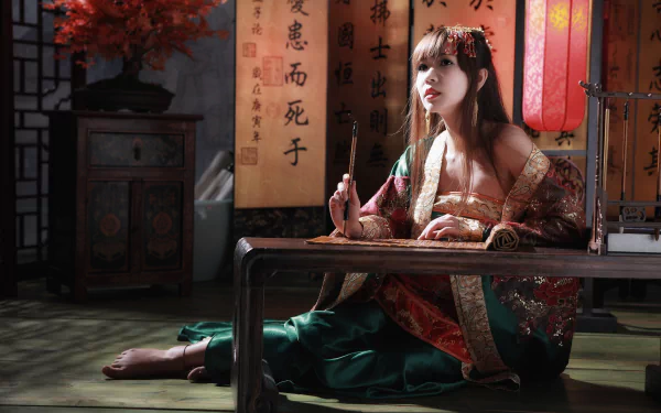 A woman in traditional Taiwanese dress sits gracefully beside calligraphy scrolls and a bonsai, embodying cultural elegance in this vibrant 4K Ultra HD wallpaper.