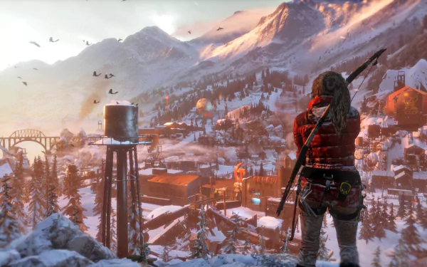 Lara Croft stands overlooking a snowy landscape in this HD desktop wallpaper from Rise of the Tomb Raider, capturing the adventure and beauty of the game's environment.