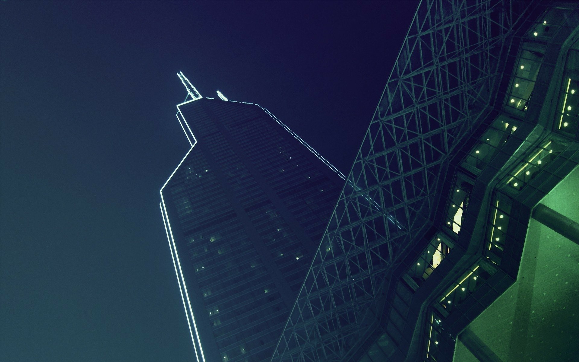 HD PC desktop wallpaper and background: urban architecture featuring a neon-edged, man-made skyscraper beside a steel lattice structure at night.