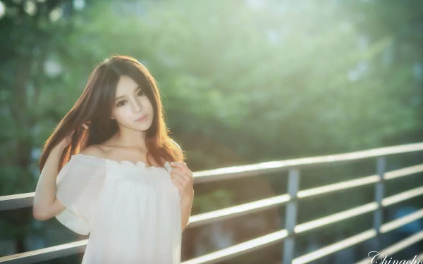 Portrait of a Taiwanese woman, Julie Chang, with soft bokeh background, captured in 4K Ultra HD quality as a PC desktop wallpaper.