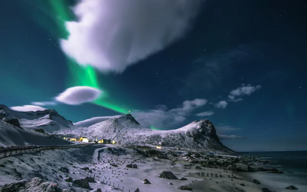 A stunning 4K Ultra HD image of the Lofoten Islands in Norway, capturing the mesmerizing aurora borealis illuminating a snowy landscape under a starry sky.