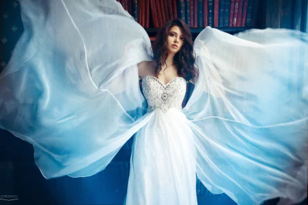 A bride in an elegant wedding dress poses gracefully in a library, the flowing fabric creating a dynamic, ethereal effect, captured in HD for a desktop wallpaper.