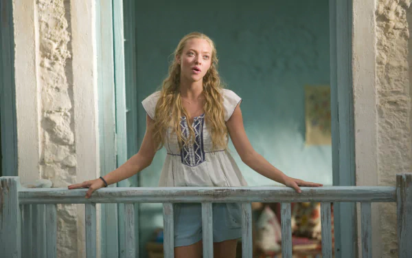 Amanda Seyfried in a scene from the movie Mamma Mia!, featured in a 4K Ultra HD PC desktop wallpaper and background.