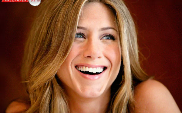 HD desktop wallpaper featuring a close-up of celebrity Jennifer Aniston smiling against a warm, blurred background.