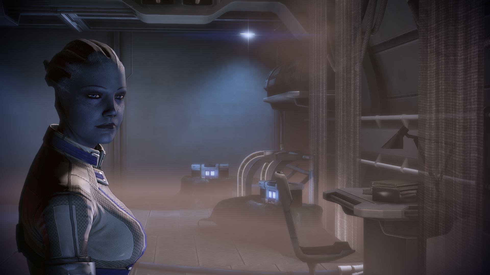 HD PC desktop wallpaper/background featuring video game character Liara T'Soni from Mass Effect, a blue-skinned Asari standing in a dim, atmospheric sci-fi corridor.
