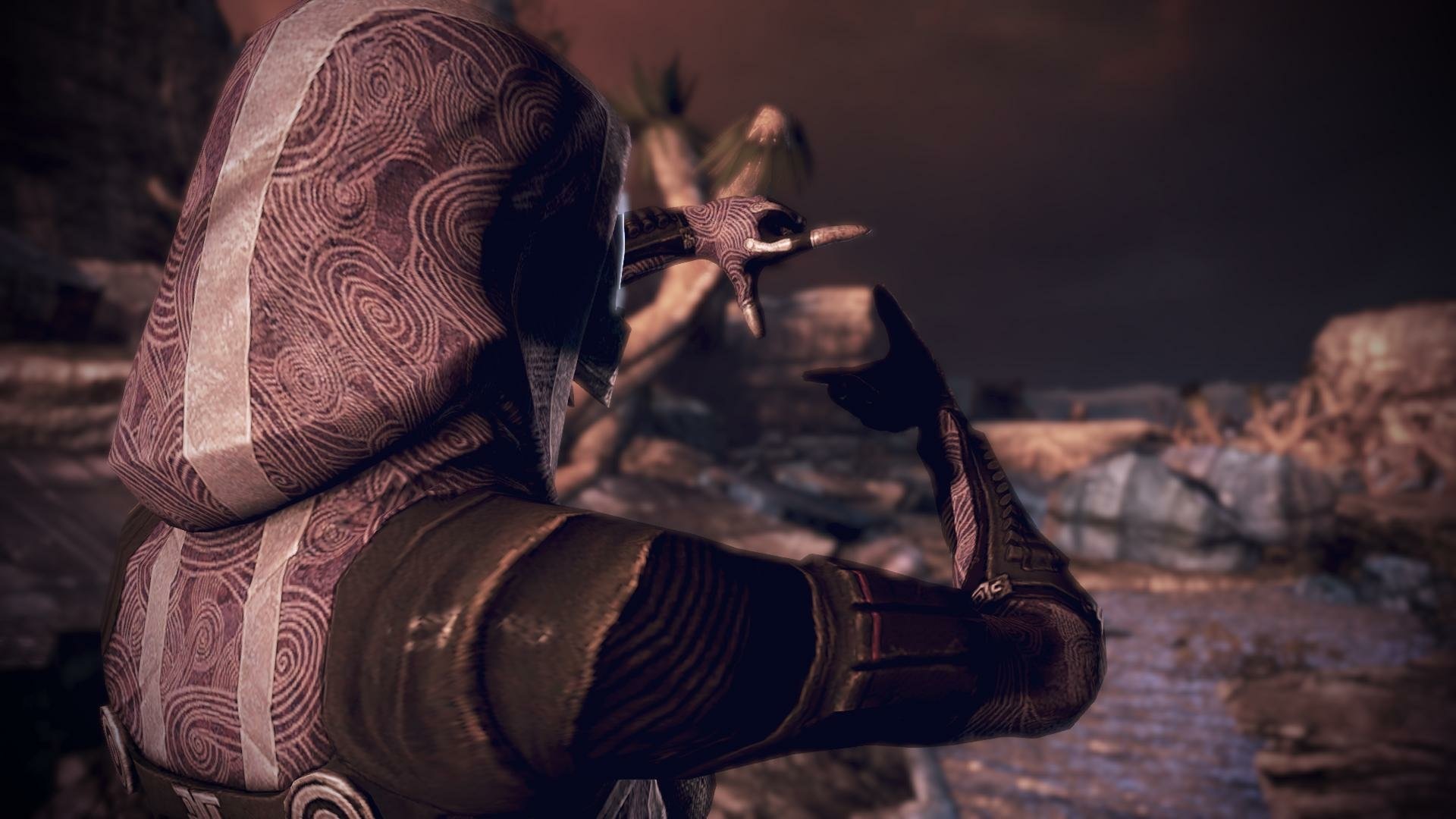 HD PC desktop wallpaper featuring Tali'Zorah from the Mass Effect video game, showing her in detailed armor with a rocky, alien landscape background.