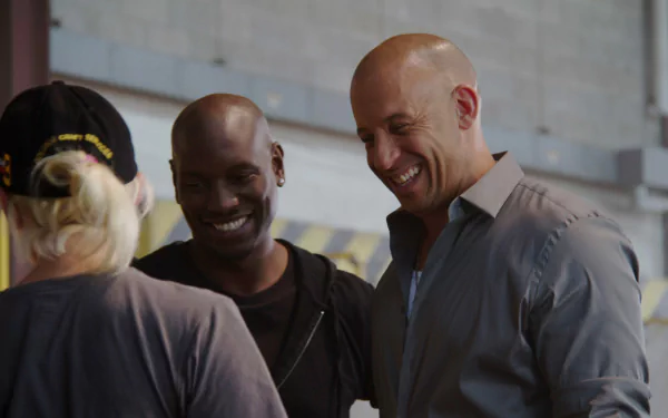 Tyrese Gibson and Vin Diesel share a lighthearted moment on the set of Furious 7 in this HD desktop wallpaper, capturing the camaraderie between the film's stars.