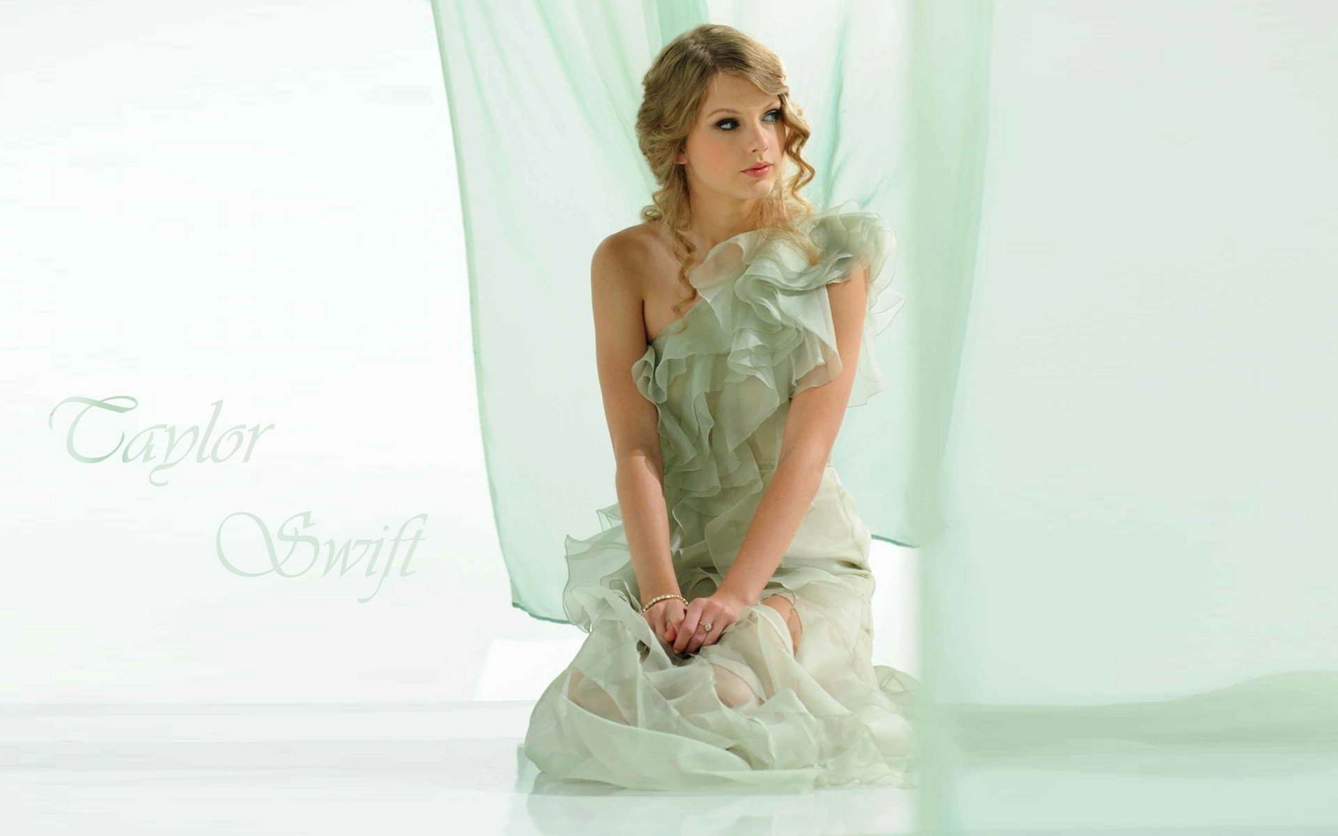 HD PC desktop wallpaper featuring Taylor Swift in a soft, airy setting, highlighting her elegance and connection to music.