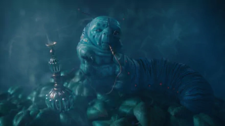 HD PC desktop wallpaper of the blue hookah-smoking caterpillar from the movie Alice in Wonderland (2010), surrounded by swirling teal smoke and a misty, dreamlike background.