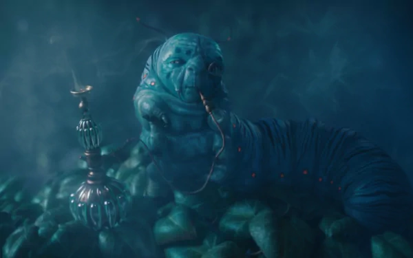 HD PC desktop wallpaper of the blue hookah-smoking caterpillar from the movie Alice in Wonderland (2010), surrounded by swirling teal smoke and a misty, dreamlike background.