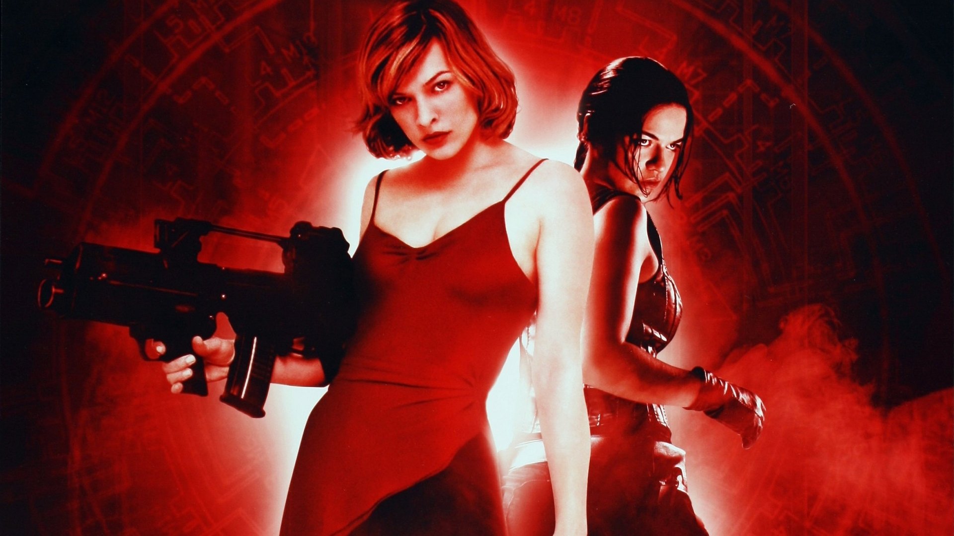 Michelle Rodriguez and Milla Jovovich pose fiercely in this HD wallpaper from the movie Resident Evil, set against a striking red background.