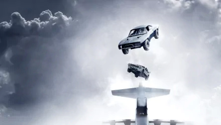 HD desktop wallpaper featuring a dramatic scene from the movie Furious 7, tagged under Fast & Furious, with cars mid-air above an airplane amidst clouds.