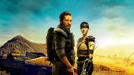 Max Rockatansky and Imperator Furiosa stand fiercely in a desert landscape from Mad Max: Fury Road, showcasing their strength and resilience against a dramatic backdrop.