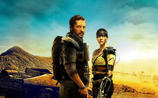 Max Rockatansky and Imperator Furiosa stand fiercely in a desert landscape from Mad Max: Fury Road, showcasing their strength and resilience against a dramatic backdrop.