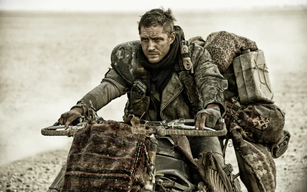 Max Rockatansky, played by Tom Hardy, rides a rugged motorcycle in a desert scene from the movie Mad Max: Fury Road, captured in 4K Ultra HD.