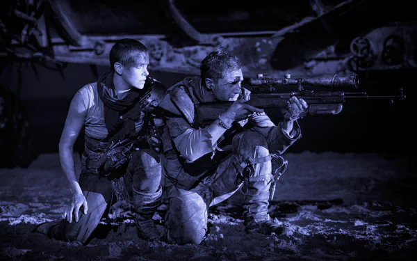 A dramatic black and white scene from Mad Max: Fury Road featuring Imperator Furiosa (Charlize Theron) and Max Rockatansky (Tom Hardy) in a tense moment.