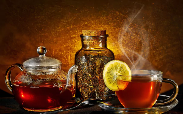 A captivating 8K Ultra HD image featuring a glass teapot, a jar of loose tea, and a steaming cup of tea with a lemon slice, set against a warm, textured background.