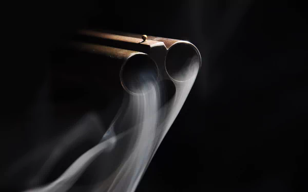 A close-up shot of a shotgun's double barrel, with smoke elegantly rising in a dark background, creating a dramatic atmosphere for a HD PC desktop wallpaper.