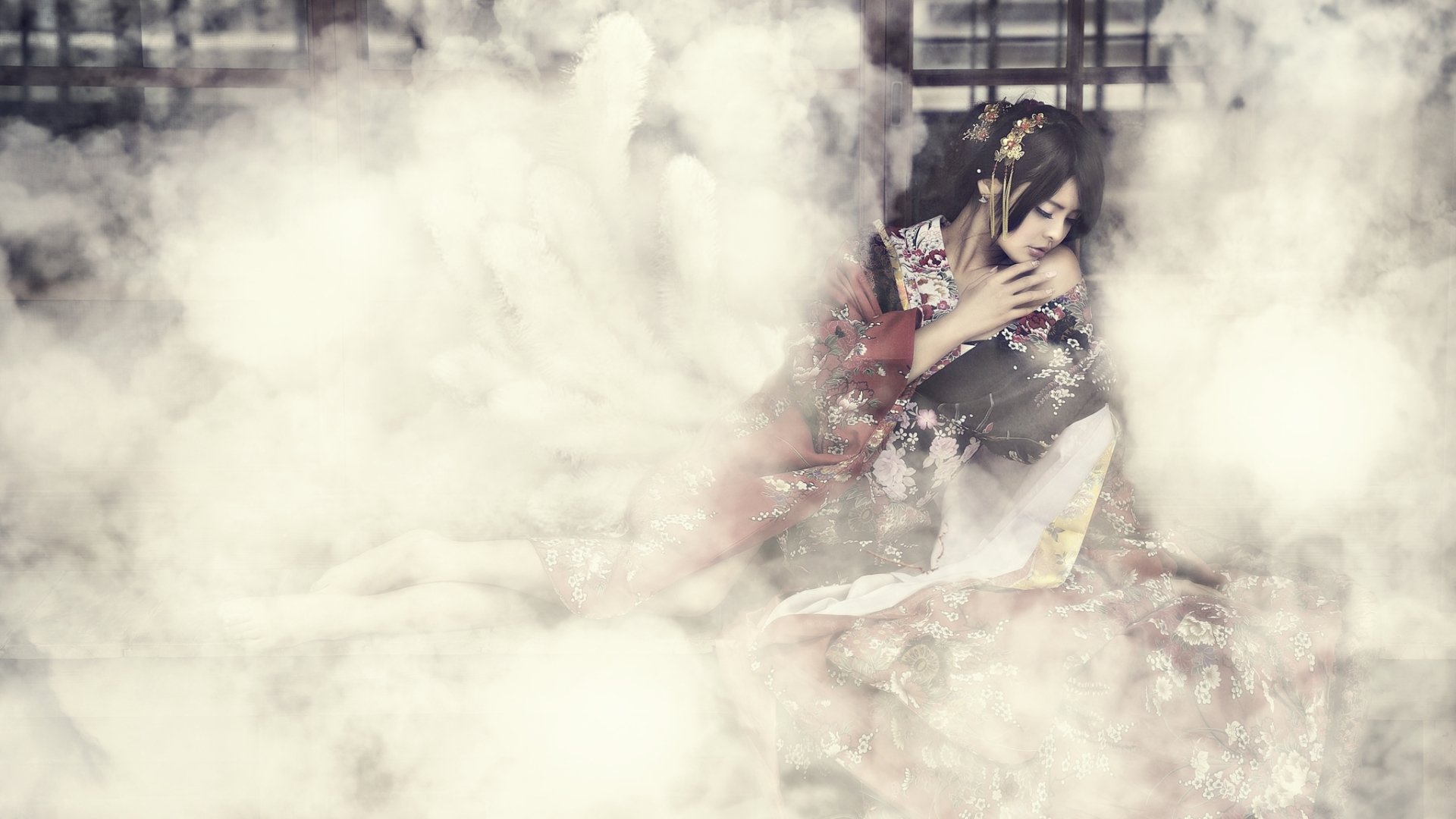An Asian woman in traditional oriental costume with elaborate hair-dress sits amidst swirling smoke in a surreal, atmospheric HD desktop wallpaper.