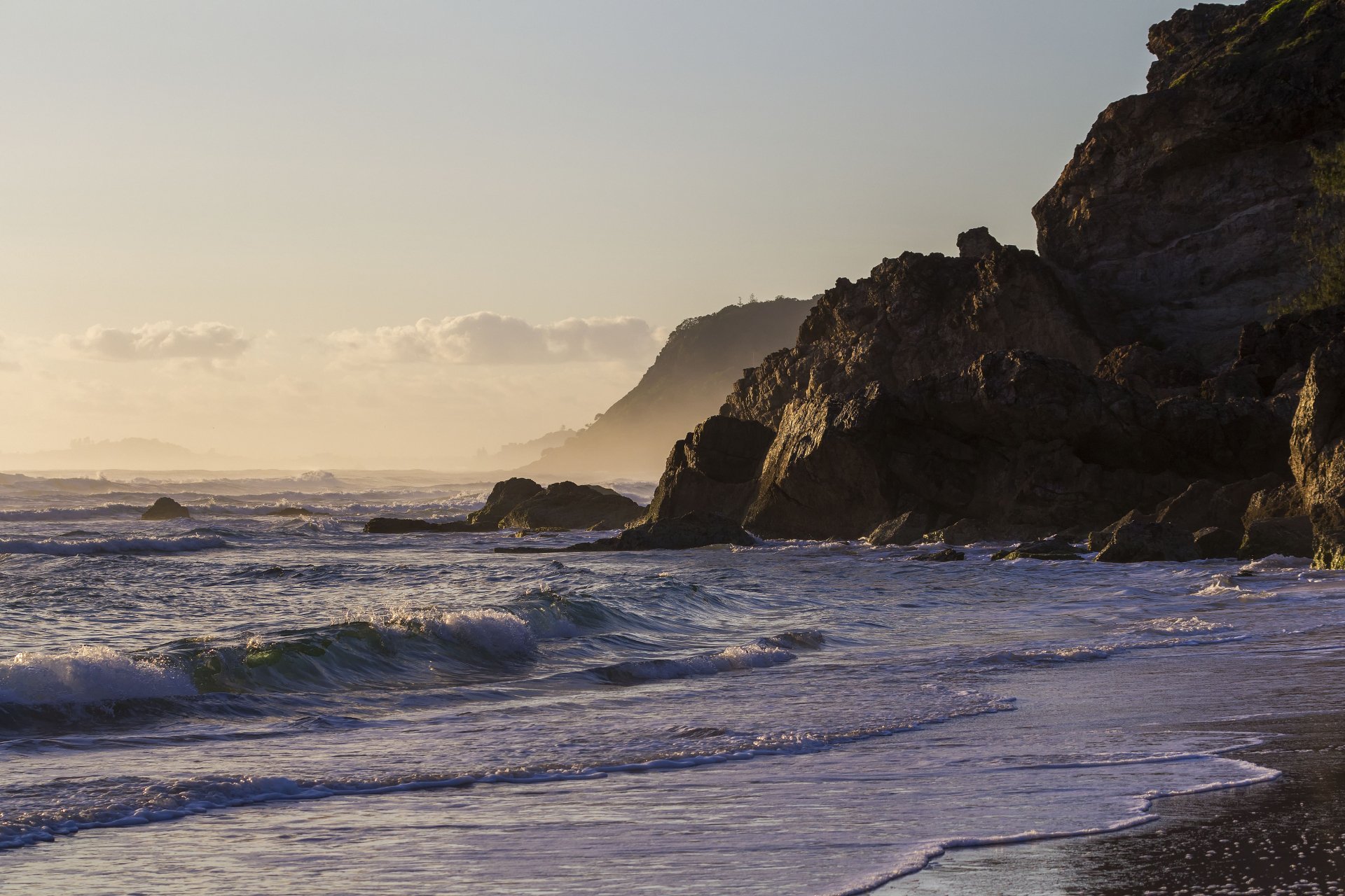Morning waves gently lap the seashore along the rugged coastline of Queensland’s Gold Coast, Australia, captured in stunning 4K Ultra HD.