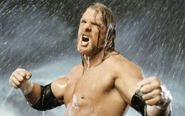Muscular pro wrestler roaring and flexing in pouring rain, fists raised — intense sports-themed 2K Quad HD PC desktop wallpaper/background.