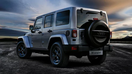 A Jeep Wrangler parked on a rugged landscape, showcasing its 4x4 capabilities under a dramatic sky. This 4K Ultra HD image serves as an eye-catching desktop wallpaper.
