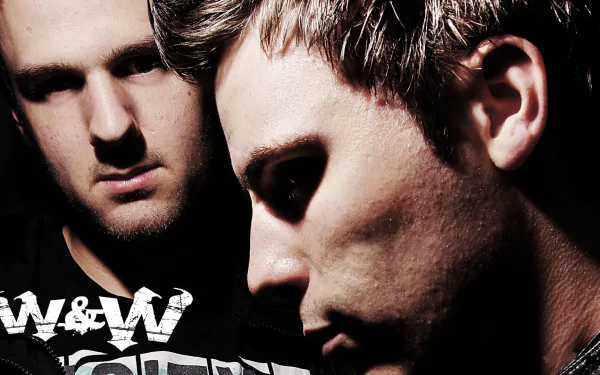 HD PC desktop wallpaper featuring close-up portraits of the DJs W&W, highlighting their intense expressions in a dark, moody music-themed setting.