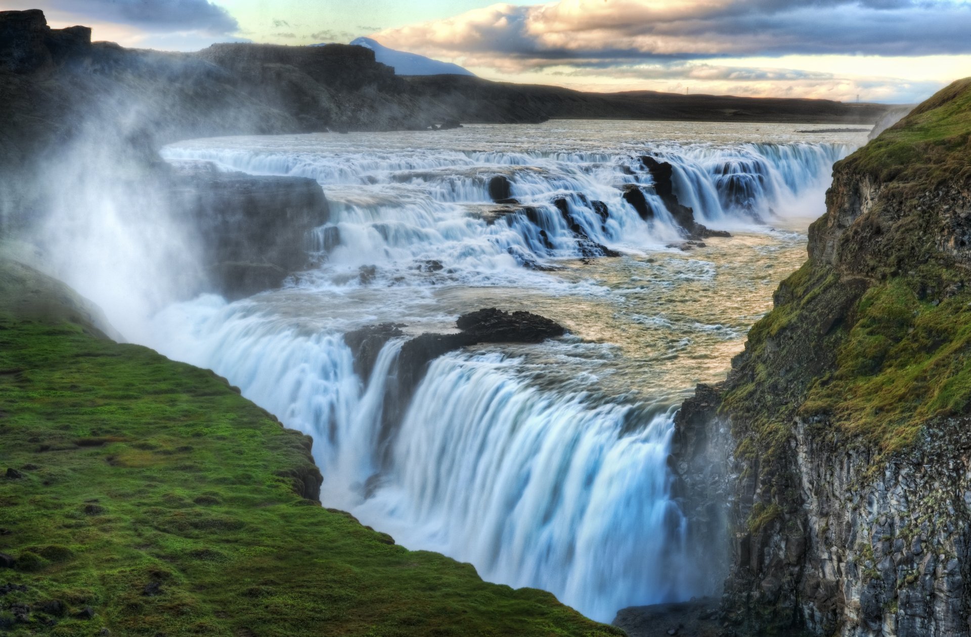 A stunning 4K view of Gullfoss waterfall on the Hvítá River, flowing through the canyon near Langjökull glacier in Arctic Iceland's natural landscape.