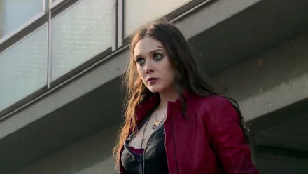 Wanda Maximoff, also known as Scarlet Witch, captured in a moment from Avengers: Age of Ultron. The image showcases her intense focus and striking appearance.