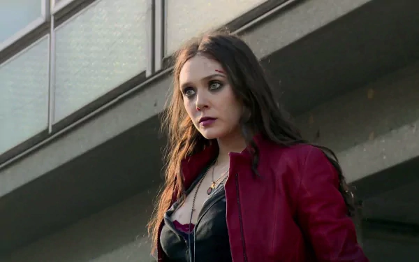 Wanda Maximoff, also known as Scarlet Witch, captured in a moment from Avengers: Age of Ultron. The image showcases her intense focus and striking appearance.