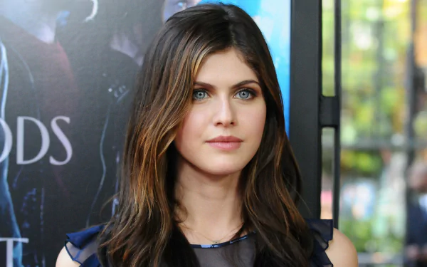 HD desktop wallpaper and background featuring celebrity Alexandra Daddario, showcasing a close-up of her with long, flowing hair and a vibrant, focused expression.