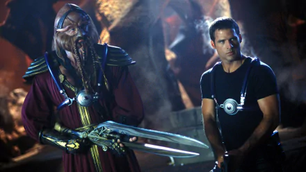 HD desktop wallpaper featuring characters from the TV show Farscape, showcasing a dramatic sci-fi scene with an alien warrior and a human protagonist.