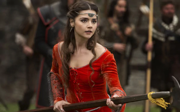 Jenna Coleman as Clara Oswald in Doctor Who (2005), depicted in a detailed 4K Ultra HD PC desktop wallpaper scene with medieval-style attire and intense expression.