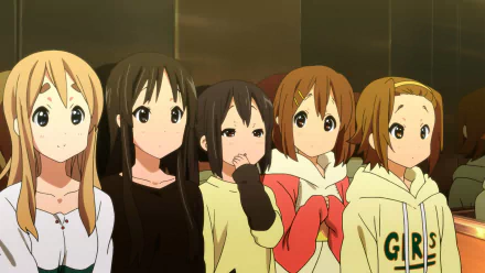 A colorful HD desktop wallpaper featuring Azusa Nakano, Tsumugi Kotobuki, Ritsu Tainaka, Yui Hirasawa, and Mio Akiyama from the anime K-ON!. The characters are shown together, expressing various emotions.