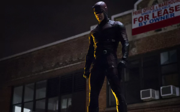Daredevil from the TV show stands on a rooftop at night, highlighted in dramatic lighting. This 4K Ultra HD image serves as a striking PC desktop wallpaper.